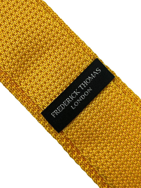 Yellow gold knitted tie with white polka spots